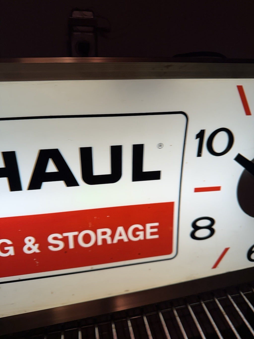 1960-70s UHaul lighted sign with clock. 11.5 X 24.5”2