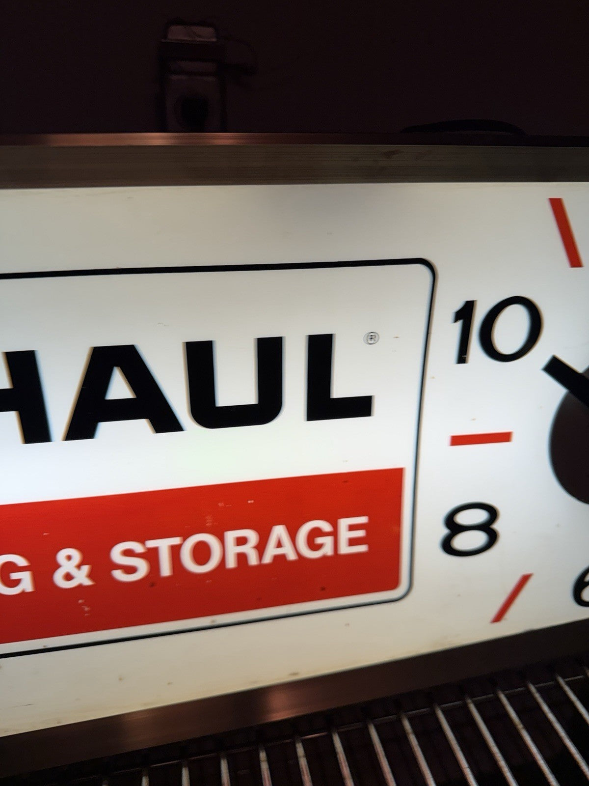 1960-70s UHaul lighted sign with clock. 11.5 X 24.5”2