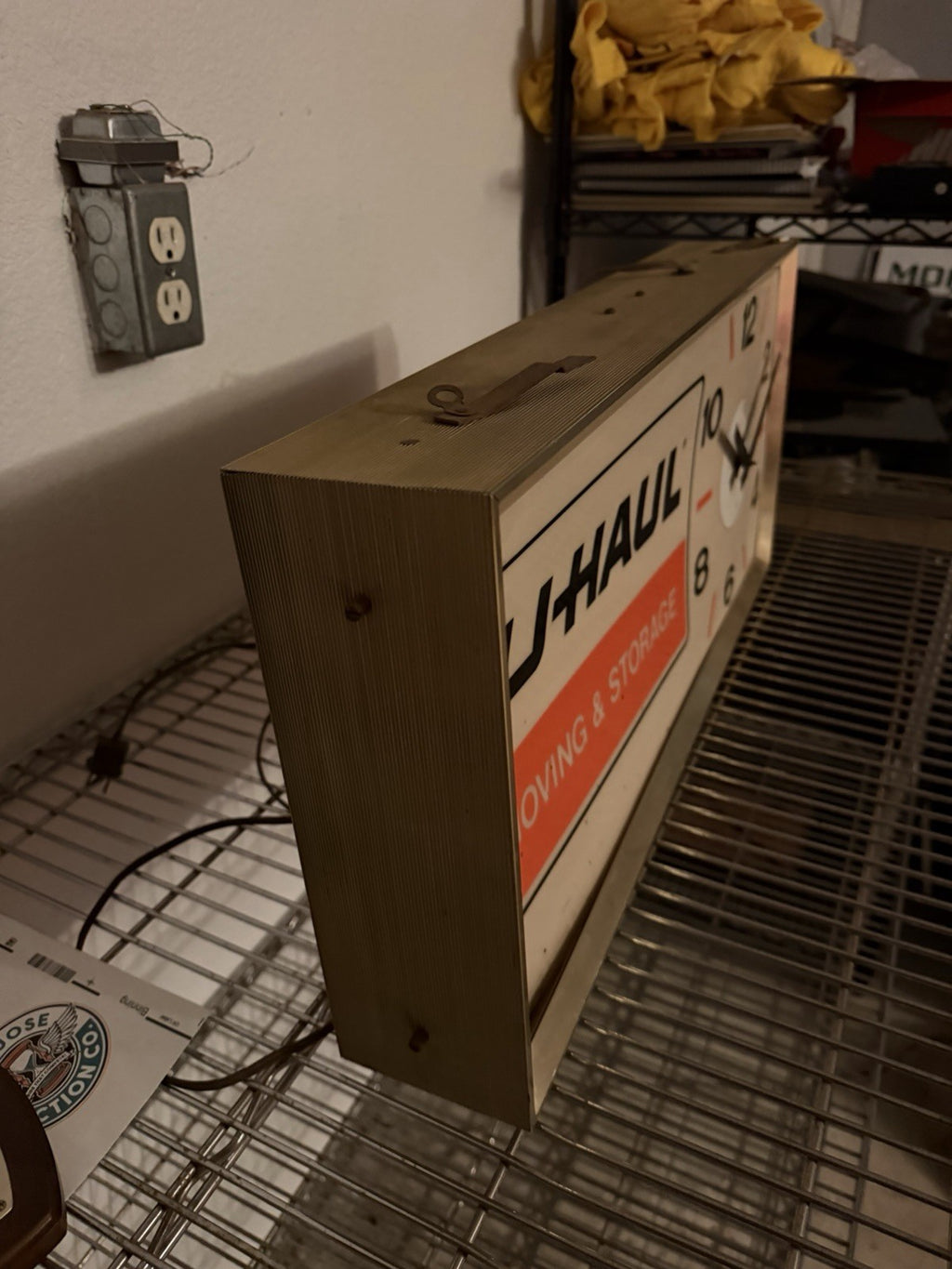 1960-70s UHaul lighted sign with clock. 11.5 X 24.5”4