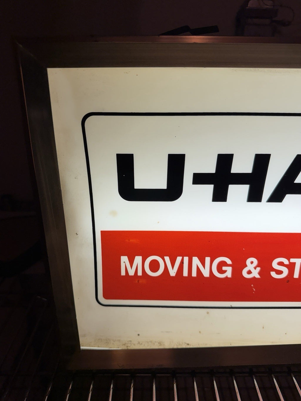 1960-70s UHaul lighted sign with clock. 11.5 X 24.5”1