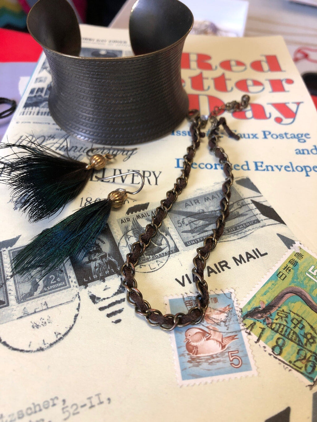 bronze Cuff Bracelet, Leather Choker, And Peacock Earring0
