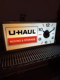 1960-70s UHaul lighted sign with clock. 11.5 X 24.5”0